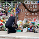 Reggie Daniels pays his respects at a memorial at Robb Elementary School in Uvalde, Texas, on June 9, 2022, honoring the two teachers and 19 students killed in the shooting at the school on May 24.